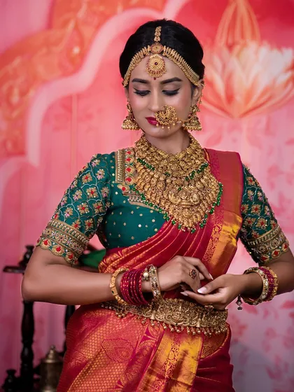 Another angle of the dusky bridal look, showing the rich colours of the saree and the detailed jewellery.