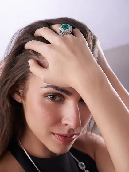A product doesn't just exist on a white background; it lives with people. For Solitario Diamonds, we brought the jewelry to life by showing it in a lifestyle context. This shot focuses on the connection between the person and the piece, capturing the emotion and elegance of wearing a stunning emerald ring.