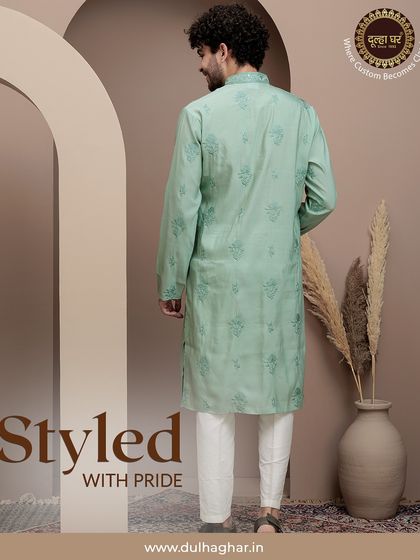 Styled with pride. The back view of the mint green printed kurta, showing the continuity of the pattern and its excellent drape.