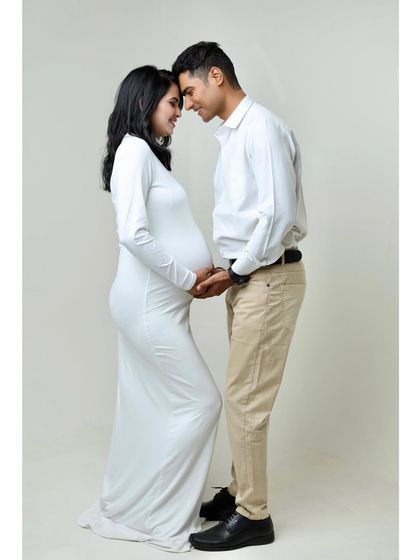 A full-length view of the couple in white, showing their connection from head to toe. This pose is both intimate and elegant.