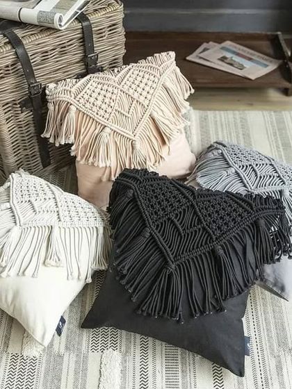 A collection of our macrame cushion covers, showing the different colors available. They are an easy and affordable way to update your living room decor.