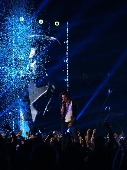 A shot from the 'Saiyaara' concert scene, with blue lighting and confetti creating a celebratory and high-energy moment.