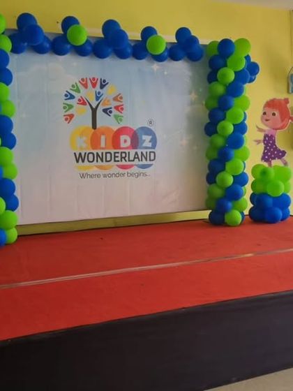 A simple Cocomelon-themed stage setup for a school or community event.