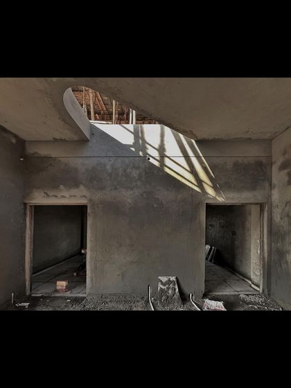 This is a raw construction shot, but it shows something really important to us: how we shape light. The cutout in the ceiling carves a path for sunlight, turning a simple corridor into a dynamic space.
