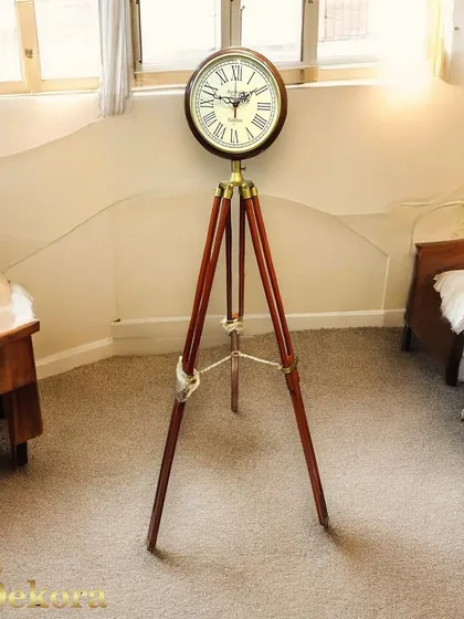 This freestanding tripod clock combines a solid wood base with a classic Roman numeral dial, serving as a sophisticated accent piece for a corner office or bedroom.
