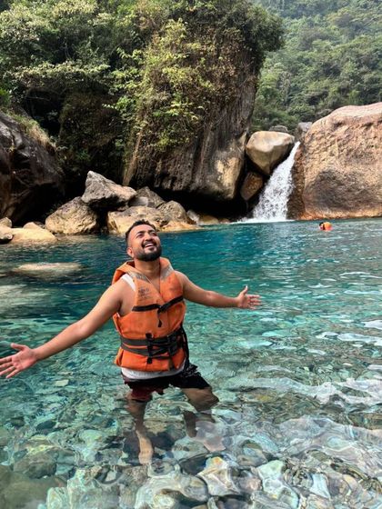 Taking a dip in the crystal clear waters of Blue Lagoon in Meghalaya. I know the best spots for a refreshing swim, away from the crowds.