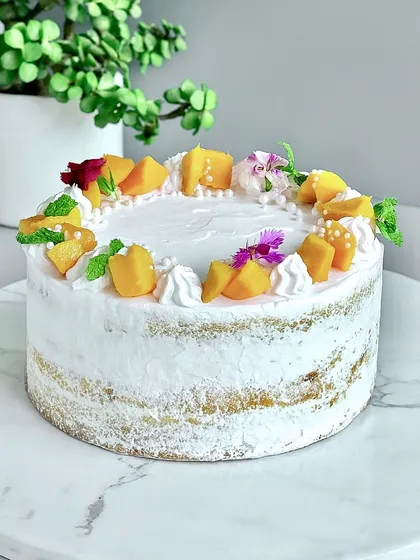 When mangoes are in season, this Fresh Mango Naked Cake is a must. I use a fluffy vanilla sponge and layer it with juicy, fresh mangoes and my signature light diplomat cream. It’s like sunshine in a slice, focusing on fresh, premium ingredients.