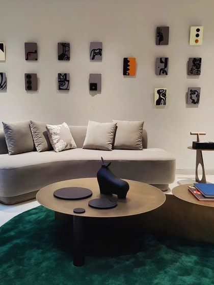 The completed installation in Hyderabad, a gallery wall of miniature abstract narratives that animate the space.