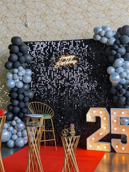 Let's make your birthday or anniversary celebration stylish and modern. We love creating trendy photo-worthy moments with sequin walls, custom neon signs, and marquee numbers, like this chic setup for a 25th birthday.