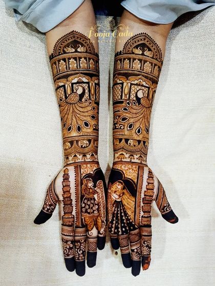 A beautiful bridal mehendi for a childhood friend, featuring couple portraits and peacock motifs, celebrating their long journey to marriage.