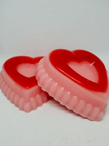 A close-up of my two-toned, heart-shaped soaps, perfect for Valentine's gifting. Each bar is handmade with care to be both beautiful and gentle on the skin.