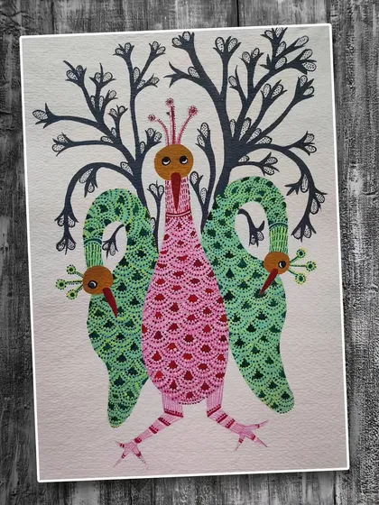 This imaginative Gond art by Ayako Sagara features a three-headed bird with tree-like wings. The piece is a wonderful example of the storytelling and mythological elements present in Gond paintings.