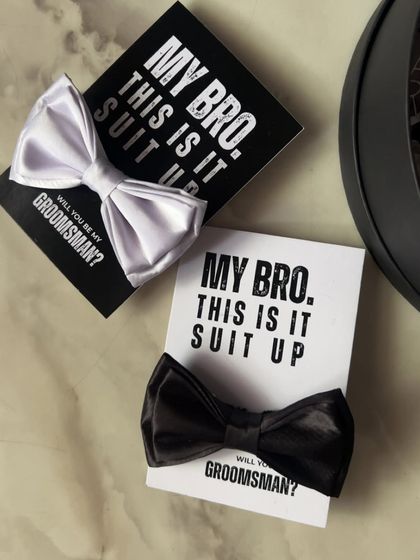 A simple and stylish groomsmen proposal. I pair a classic bow tie with a "My Bro, This is it. Suit Up" card for an effortlessly cool ask.