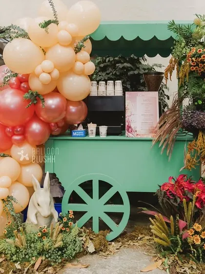 Another view of the drink cart, showing the 'Spin the Wheel' game sign in the background.
