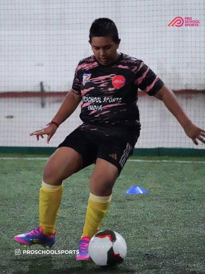 A player practices their passing technique, a crucial element of our team play philosophy.