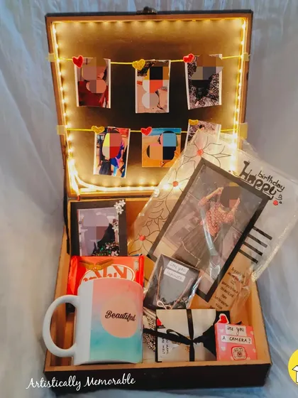 A 'You are my Person' hamper curated for a birthday, with a light-up photo garland, a custom mug, and other keepsakes.