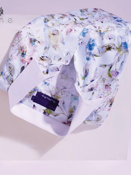 This beautiful floral print shirt features a watercolor-style design. It's a soft, artistic piece that's perfect for making a subtle impression.