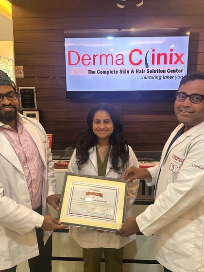 Dr. Kavish Chouhan and Dr. Amrendra Kumar presenting the fellowship certificate to Dr. Laila Haffejee from South Africa.