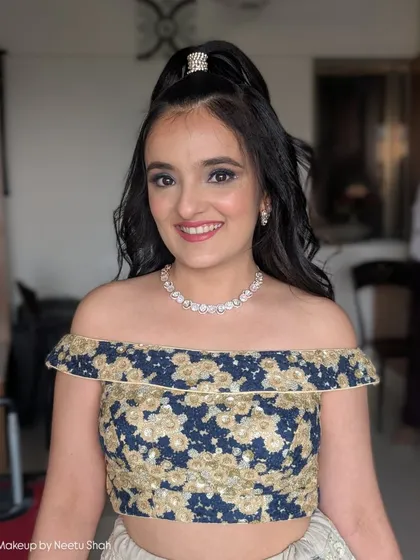 Fun and flirty glam for a party. This look features a classic smokey eye and a high, bouncy ponytail, perfect for a younger client or anyone wanting a youthful, energetic vibe.