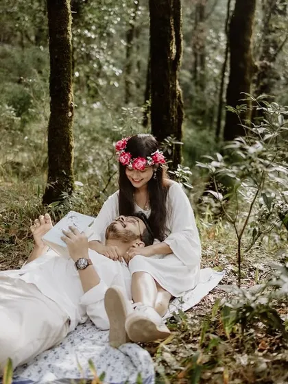 A lighthearted moment of laughter during a forest picnic. I believe the best shots are often the unposed ones, capturing your natural joy and playfulness in a beautiful, serene outdoor setting.