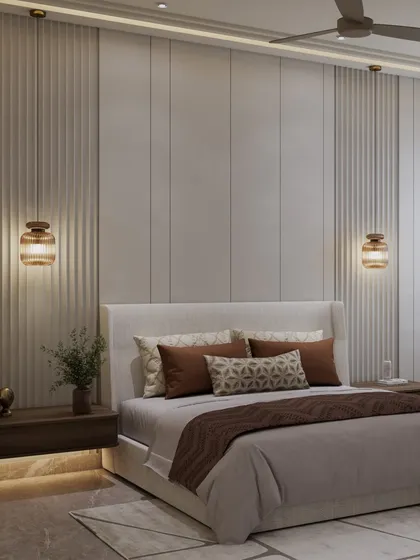 A closer look at the bed and the textured wall behind it. The muted, earthy palette of browns and beiges creates a space that is restful and quietly modern.