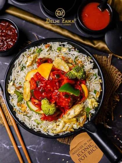 For those who love a fusion of flavors, we present our Iconic Pot Rice. This one-pot meal combines fragrant rice with saucy chicken and crisp vegetables, offering a symphony of Indo-Chinese spices.