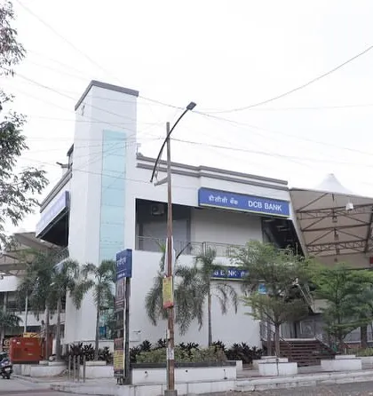 This view shows the glass lift shaft and the layered facade of the Ayur Mall. We prioritized using materials like glass and a tensile roof to create a sense of openness and reduce the reliance on artificial cooling and lighting.