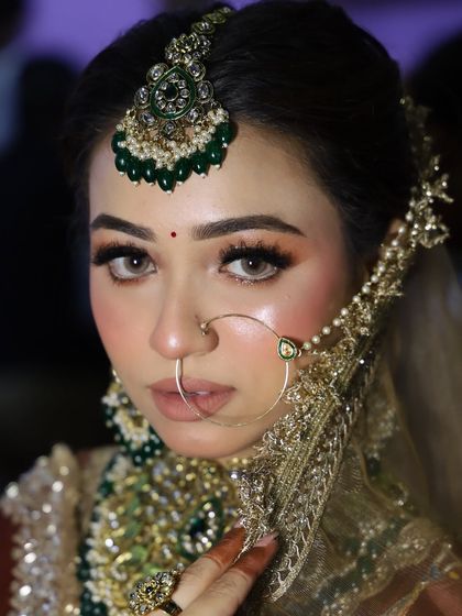 A striking close-up of our expo model. The look is powerful and confident, showcasing the artistry of the makeup.
