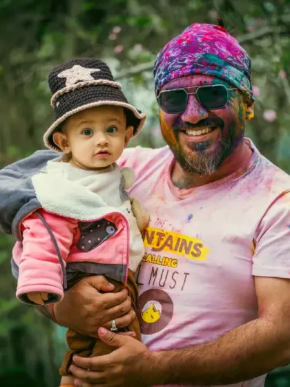 A happy portrait of a father and son duo during the Holi festival. The genuine smiles and relaxed hold show a comfortable and loving bond, which is what I aim to capture in my family photography.