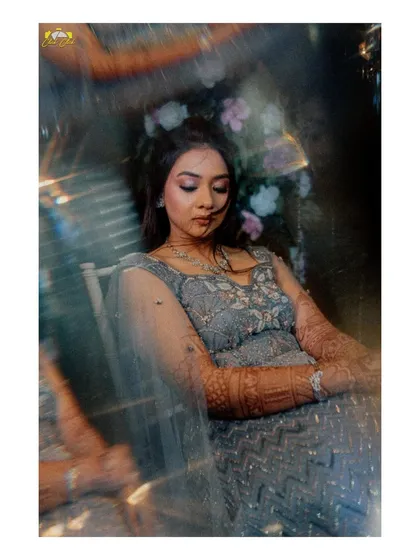 An ethereal solo portrait of the bride, Dhwnai, captured through a prism for a dreamy, magical effect.
