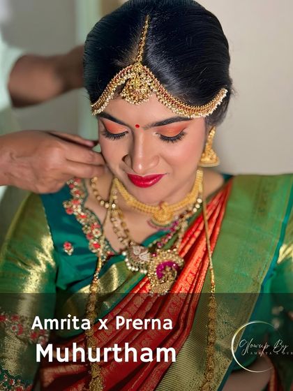 A behind-the-scenes moment of putting the final touches on Prerna's Muhurtham look.