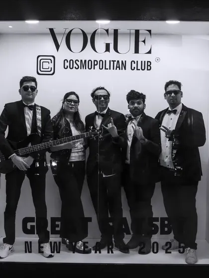 A black and white shot of the band at the Vogue Cosmopolitan Club for a New Year's 2025 celebration.