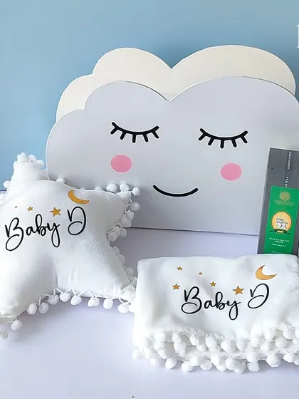 The complete 'Touch of Heaven' gift set, including the cloud-shaped keepsake box, a personalized star cushion, and a soft baby blanket.