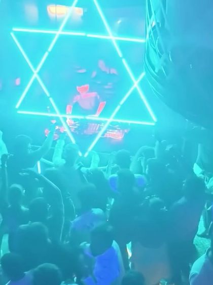 The neon Star of David setup at The Fixx provided a stunning backdrop for my Bolly-Tech set, matching the futuristic vibe of the music.