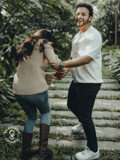 It's the playful, unposed moments that often tell the best stories. Capturing genuine laughter during a pre-wedding session in a beautiful Bangalore garden.