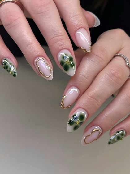 A beautiful example of the green marble or jade stone nail trend. Paired with delicate gold chrome accents, this design is earthy, elegant, and totally on-trend for the season.