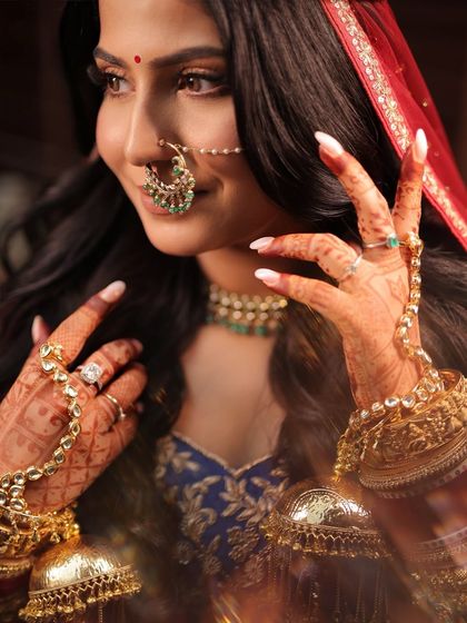 Another angle of this stunning bridal portrait. The focus is on the intricate details, from the flawless skin finish to the way the makeup complements her beautiful jewelry.