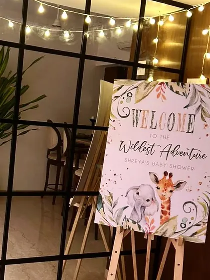 The welcome signage for the jungle-themed baby shower, inviting guests to the 'Wildest Adventure'.