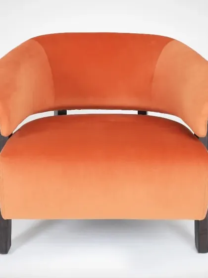 This is a catalogue-style photograph of an armchair on a seamless white background. This approach ensures the focus remains entirely on the furniture's shape, color, and texture, making it ideal for online stores.
