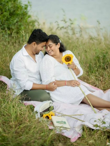 A sweet pre-wedding picnic scene, complete with sunflowers, capturing a moment of pure happiness.