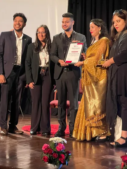 Receiving my certificate of appreciation on stage at TEDx SBSC '24. A proud moment surrounded by the event organizers and fellow speakers.