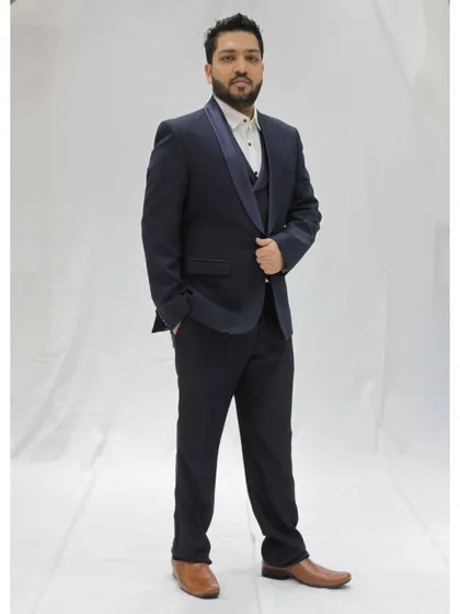A full view of my formal reception attire. A well-fitted tuxedo is my go-to for creating a sophisticated atmosphere at evening events and cocktail parties.