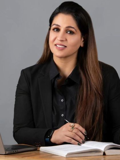 A professional photo of me at my desk. This is where the planning for my foundation's initiatives and legal cases takes place.