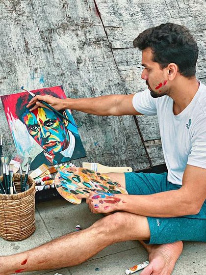 Another view of me painting the vibrant Al Pacino portrait. This shows the hands on nature of my work and the kind of active creating we do in our sessions.