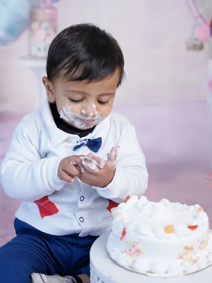 Let them eat cake! A first birthday cake smash is a wonderfully messy and joyful milestone. This little one is having the time of his life, and I'm here to capture every sweet, sticky moment.