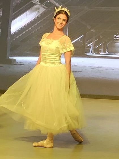 A simple, happy moment backstage in a beautiful romantic-style tutu. Embodying grace and poise is a core part of ballet, and I love helping my students find their own confidence and elegance through dance.
