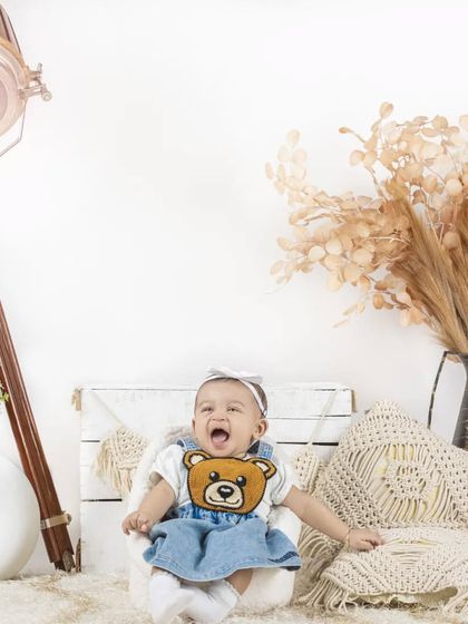 A big, happy yawn from this little one in our cozy lifestyle setup. Even sleepy moments are adorable.