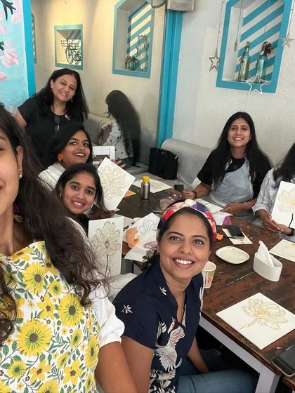 A selfie with a group of happy participants at a texture art workshop. Their smiles are as bright as their paintings.