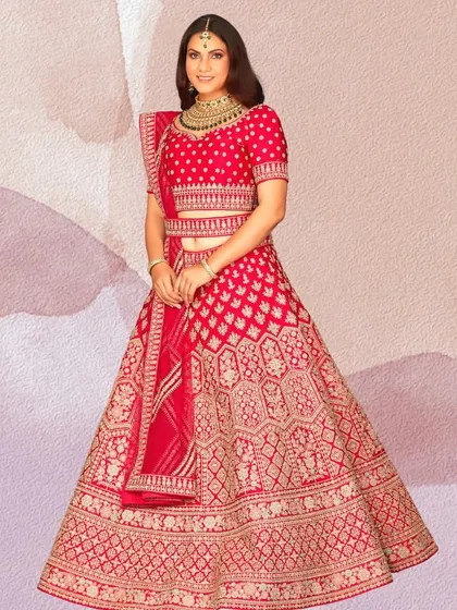 This vibrant red lehenga with intricate gold patterns is designed to make you shine. It’s a classic choice that embodies the celebratory spirit of an Indian wedding.