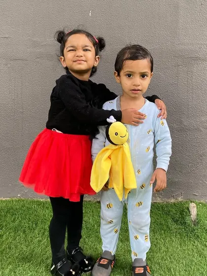 A ladybug and a bee, friends forever. Dress-up days like our 'Insects' theme encourage imagination, social interaction, and make learning about nature incredibly fun.